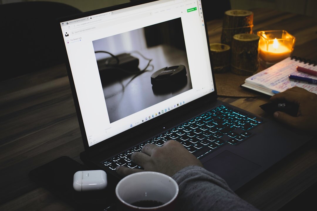 Photo editor reviewing documentary photographs on a laptop